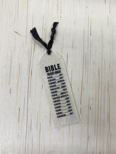 Load image into Gallery viewer, Frosted plastic bookmark with text on a textured surface