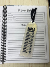 Load image into Gallery viewer, Notebook with a bookmark labeled &#39;Bible&#39; on a wooden surface
